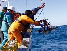 Marine geological survey using a small ship.